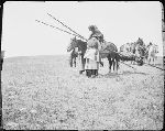 F403. Medicine Lodge. Woman Mounting Horse.