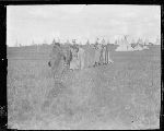 F813. Priests and Woman Going to Bless Center Pole. Line Going to Sun Lodge.