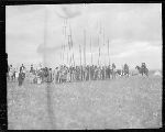 F813f.2. Priests and Woman Going to Bless Center Pole. Warriors Marching With Poles.