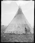 F901. War Tipi. Front View. Boy. South Side.