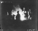 SF-334. Dancers at Night. Man in Foreground With Medicine Bundle.