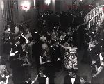 Students and their dates dancing at the junior prom.