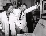 Dr. Gertrude Van Wageren and Dr. John L. McMaris examine a chart.