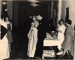 Student and his date at the punch bowl at the freshman dance.