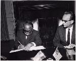Conjeevaram Natarajan Annadurai signing a book.