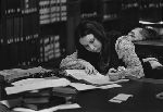 Female student studying in the library.