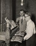 Elliott Hirsh Kone, BA 1949, (rear) and Gordon M. Rogoff, BA 1952, at the chimes stand on the playing level of Harkness Tower.
