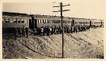 Men standing along a train at Camp Gordon, near Chamblee, Georgia.