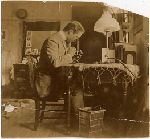 Edward Hume in his room at his microscope.