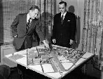 Mayor Richard C. Lee and Frank O'Brion of the Redevelopment Agency look over the model of the Oak Street Project Area in the Mayor's Office in City Hall.
