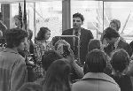 Ralph Nader, talking with a group of people.