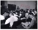 Students in sophomore summer reading examination.