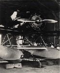 Charles A. Lindbergh and Anne Morrow Lindbergh, Pacific Survey Flight. Tokyo, Japan. "Tingmissartoq" in hangar.