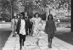 Three women walking to their Freshman Assembly.