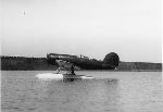 Charles A. Lindbergh and Anne Morrow Lindbergh in their Lockheed "Sirius" on flood waters in China, during the Pacific Survey Flight.