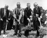 Mayor Richard C. Lee and others shoveling dirt at a groundbreaking ceremony.