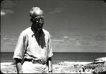 Dr. Dana Atchley on a beach.